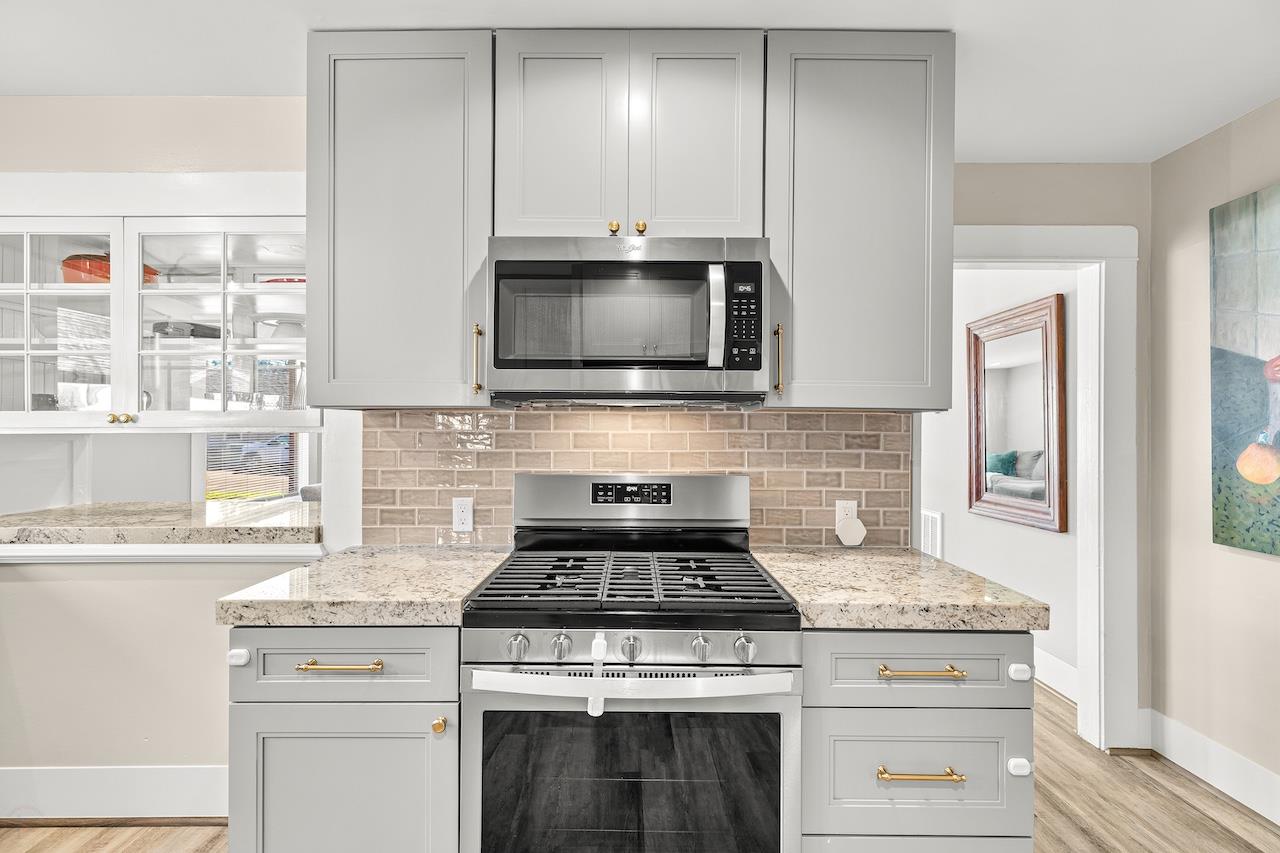 319 West 12th Street Tracy, CA 95376 - Photo 20 of 51 a stove top oven sitting inside of a kitchen