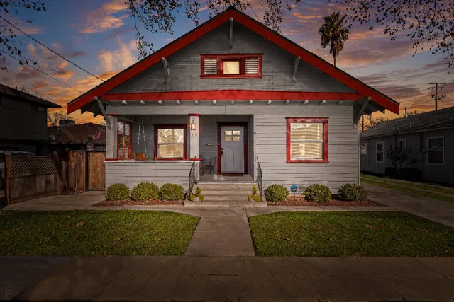a front view of a house with garden