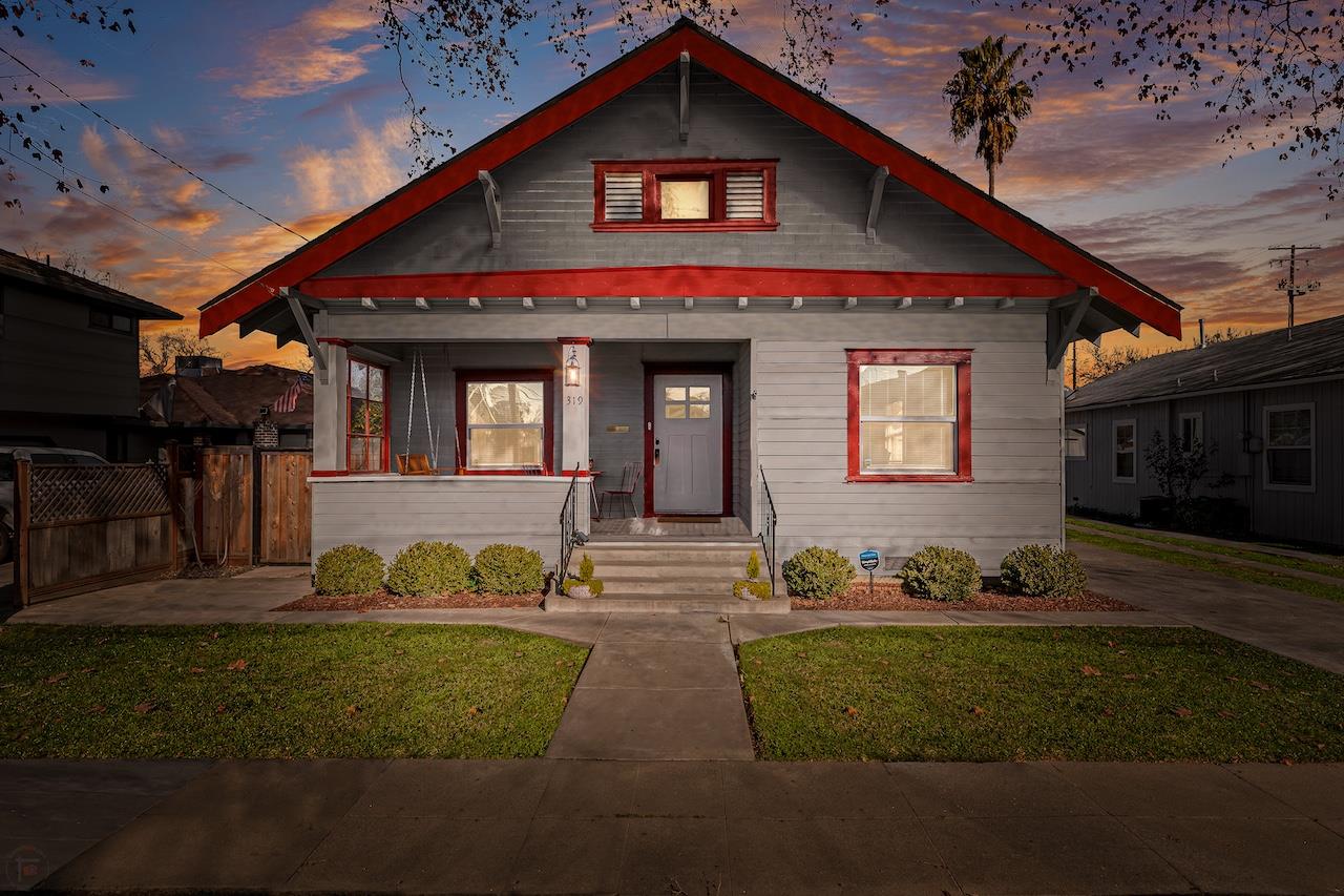 319 West 12th Street Tracy, CA 95376 - Photo 2 of 51 a front view of a house with a yard