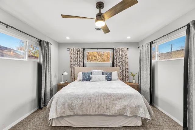 a bedroom with a large bed and a window