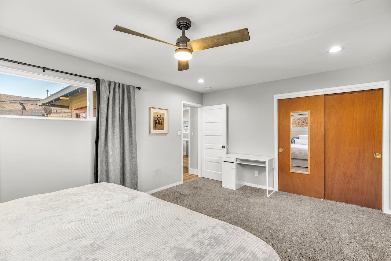 319 West 12th Street Tracy, CA 95376 - Photo 26 of 51 a bedroom with a large bed and a window