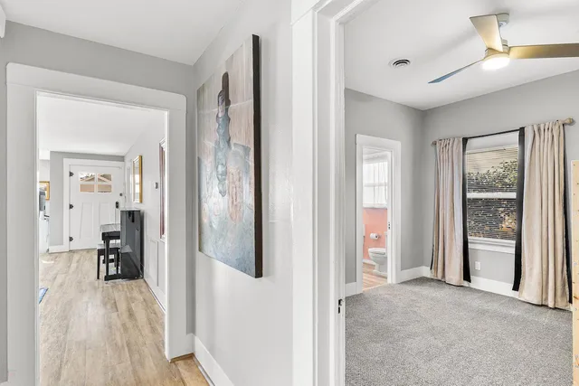 a view of a hallway with elevator and door