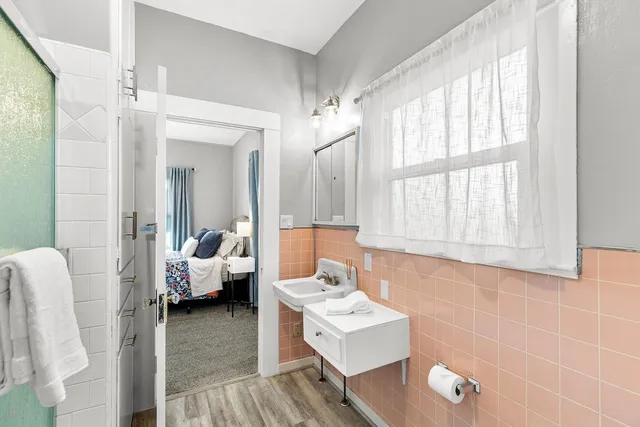 a bedroom with a large bed and a window