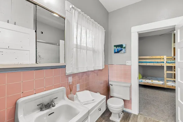 a white stove top oven sitting inside of a kitchen