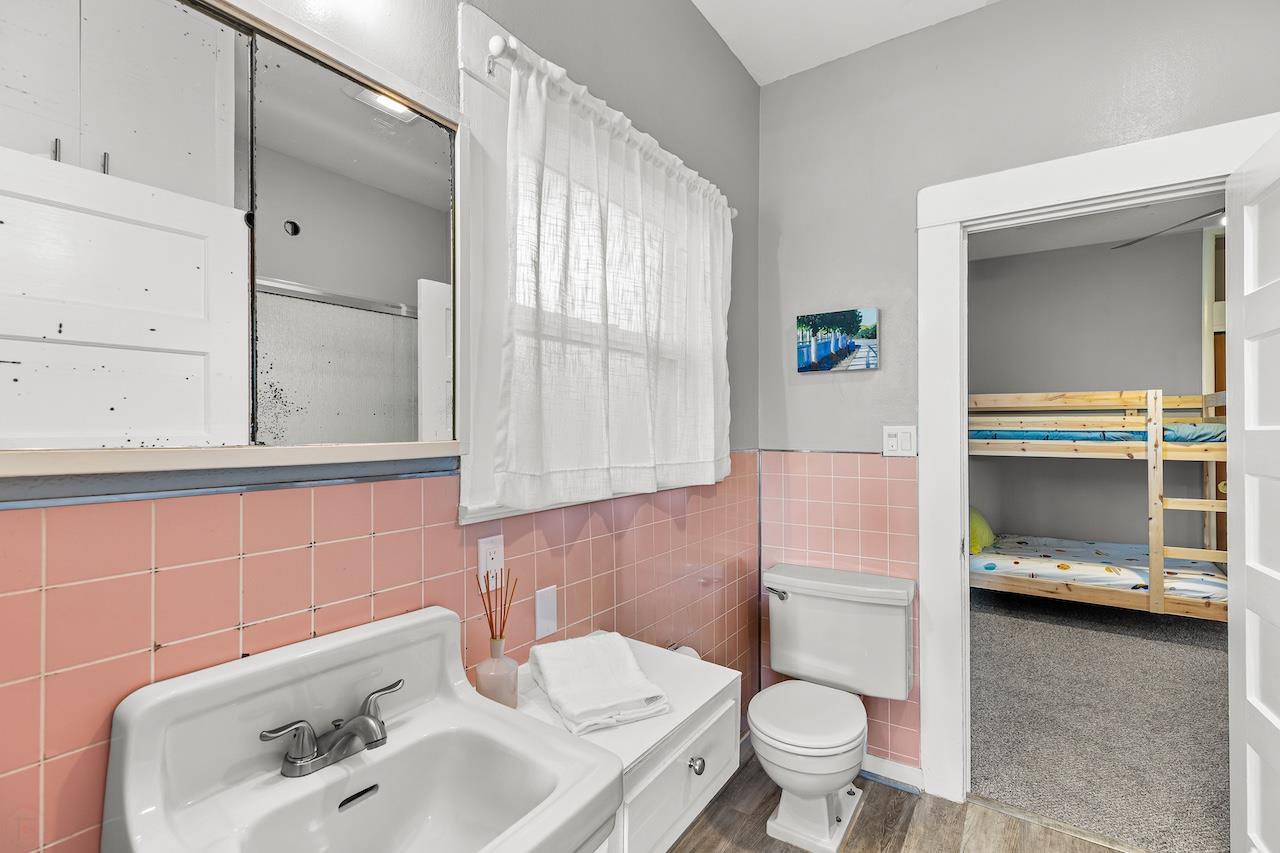 319 West 12th Street Tracy, CA 95376 - Photo 33 of 51 a bathroom with a sink a toilet and shower