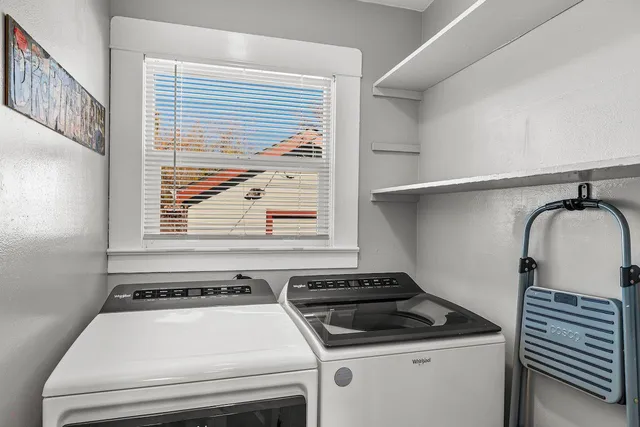 a view of a patio with a table and chairs