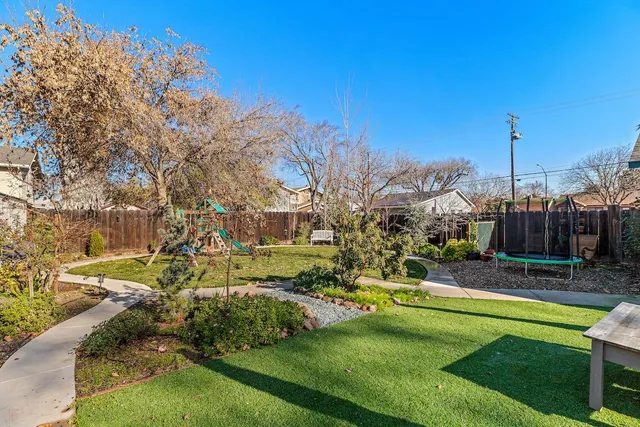 a backyard of a house with seating space
