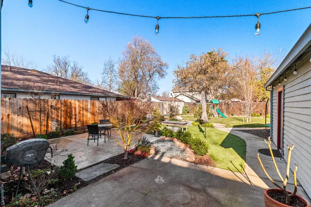 a backyard of a house with seating space