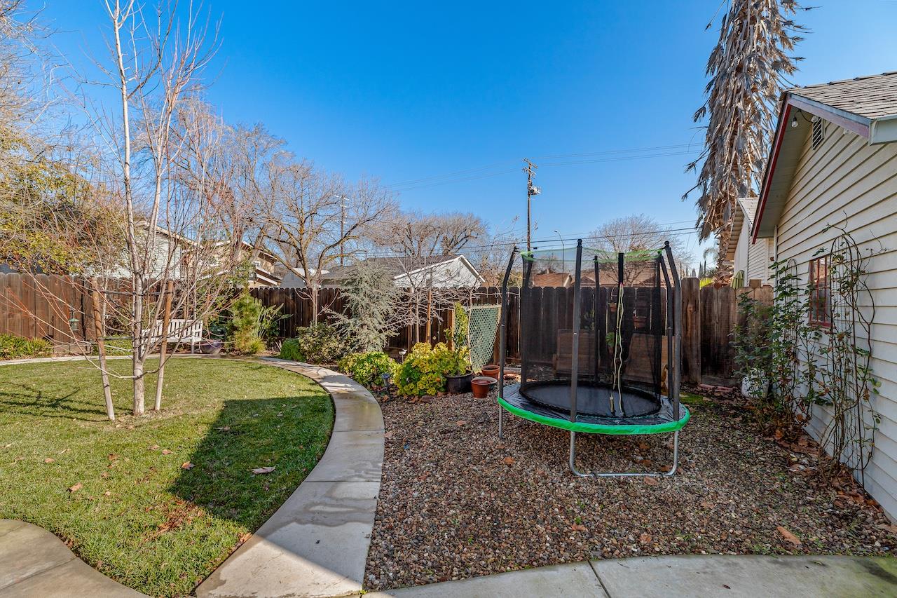 319 West 12th Street Tracy, CA 95376 - Photo 45 of 51 a view of a garden with a slide
