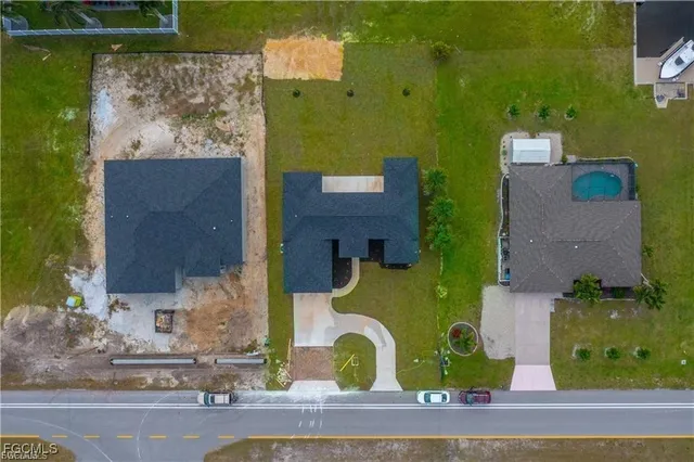 an aerial view of a house with swimming pool