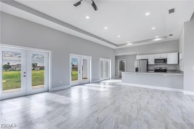 a view of living room with furniture and large window