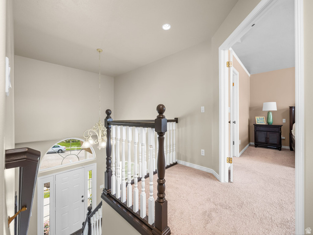 6849 North Black Powder Road Mountain Green, UT 84050 - Photo 23 of 43 Split-level entryway featuring a white paneled door with sidelights and an arched transom window
