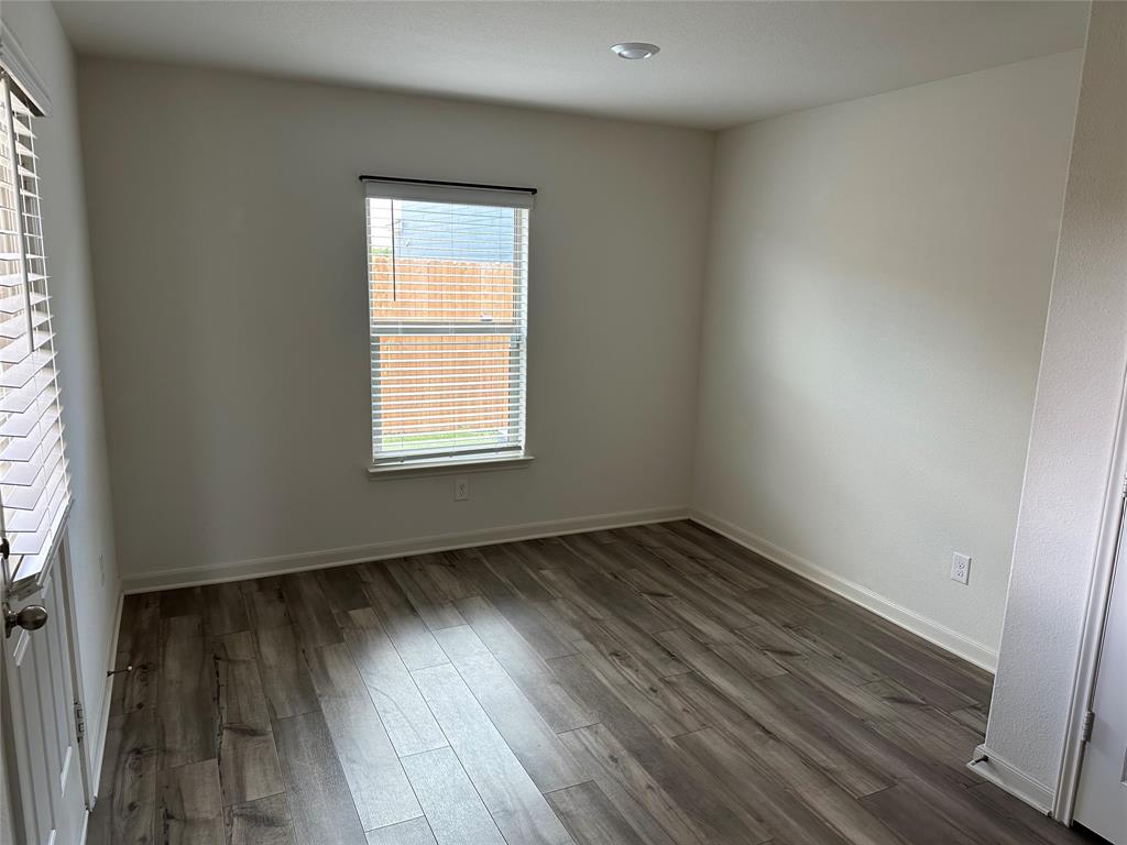 13624 Mineral Road Ponder, TX 76259 - Photo 12 of 26 Unfurnished room with dark wood-style floors and baseboards