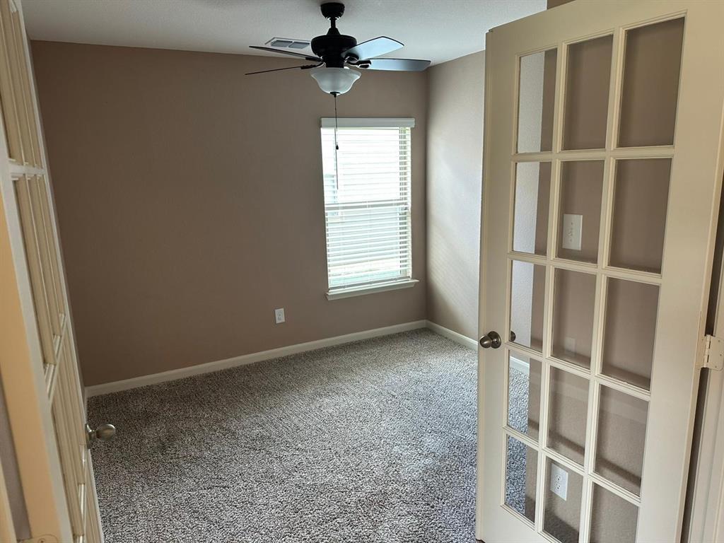 13624 Mineral Road Ponder, TX 76259 - Photo 13 of 26 Carpeted spare room with ceiling fan, french doors, and baseboards