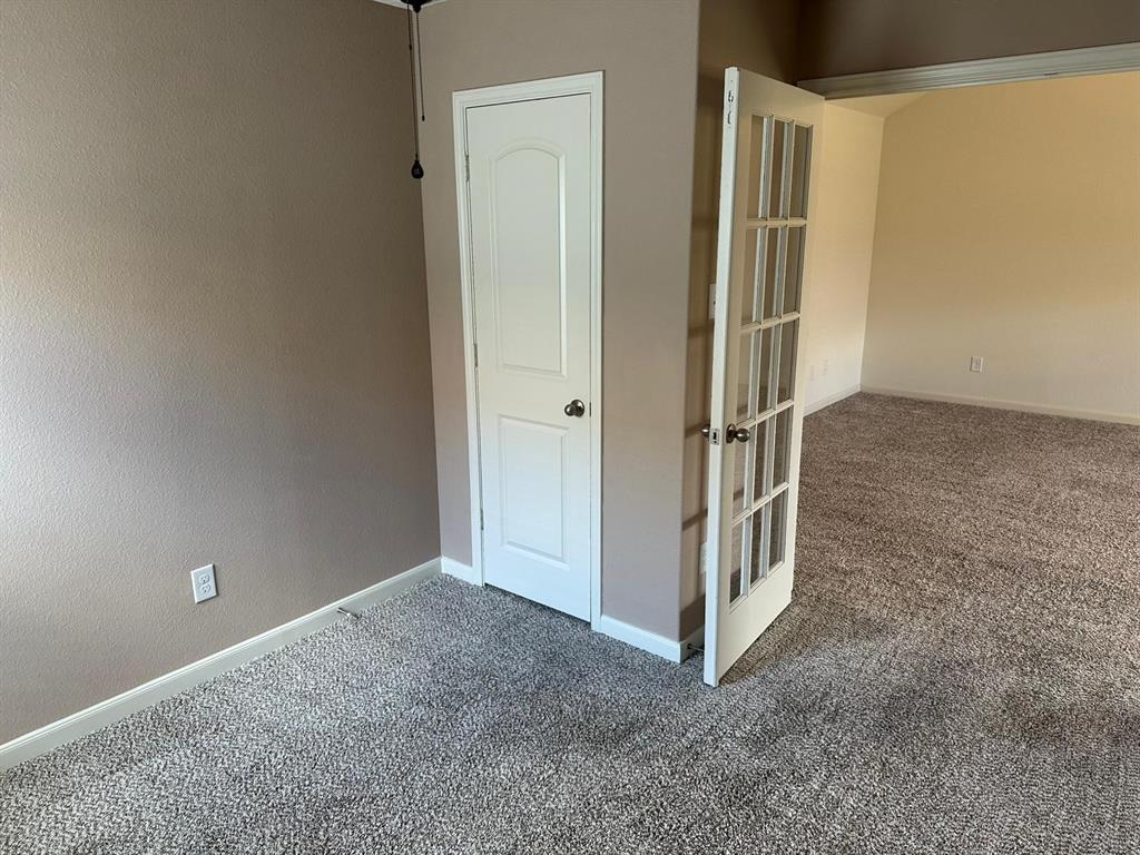 13624 Mineral Road Ponder, TX 76259 - Photo 14 of 26 Unfurnished room featuring carpet flooring, baseboards, and french doors
