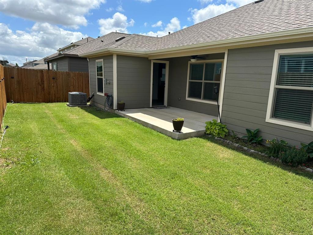 13624 Mineral Road Ponder, TX 76259 - Photo 21 of 26 Rear view of property featuring roof with shingles, a patio area, central AC unit, and a ceiling fan