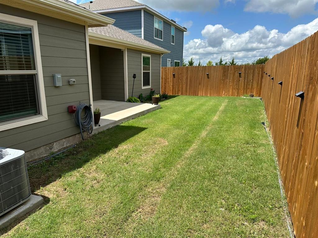 13624 Mineral Road Ponder, TX 76259 - Photo 22 of 26 View of yard featuring central air condition unit and a patio