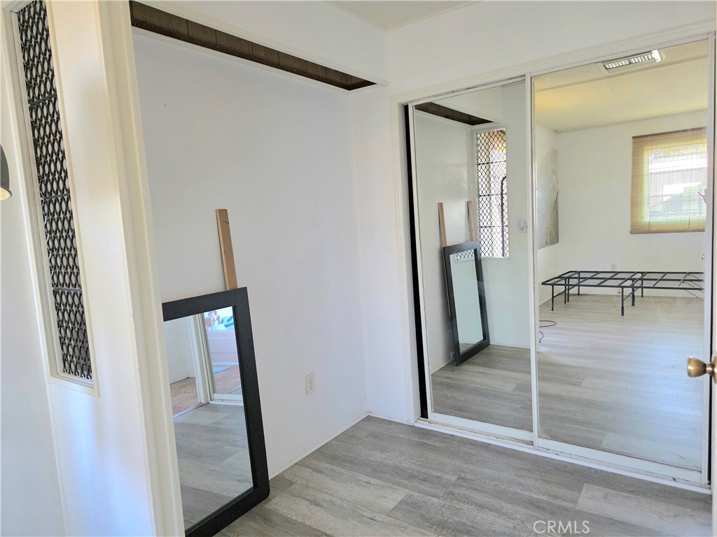 302 Sandpiper, Unit 283 Long Beach, CA 90803 - Photo 14 of 36 a view of a hallway with wooden floor