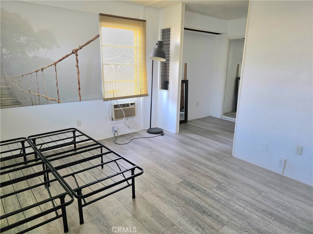 302 Sandpiper, Unit 283 Long Beach, CA 90803 - Photo 17 of 36 a view of a hallway with wooden floor and staircase