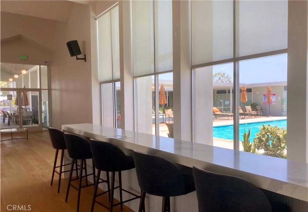 302 Sandpiper, Unit 283 Long Beach, CA 90803 - Photo 32 of 36 a view of a dining room with furniture window and wooden floor