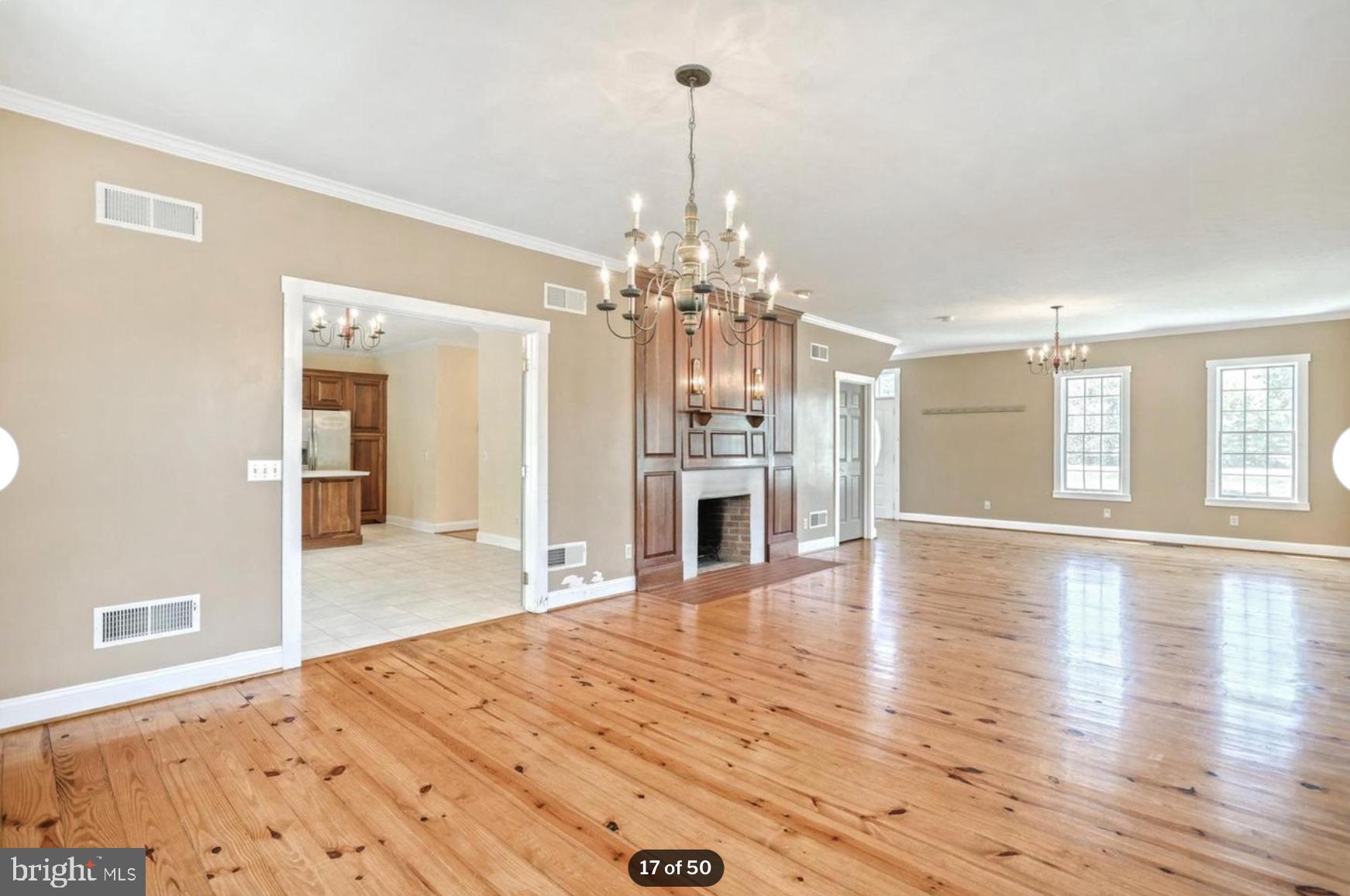 1520 Herrs Ridge Road Gettysburg, PA 17325 - Photo 17 of 51 a view of a livingroom with a chandelier wooden floor and chandelier