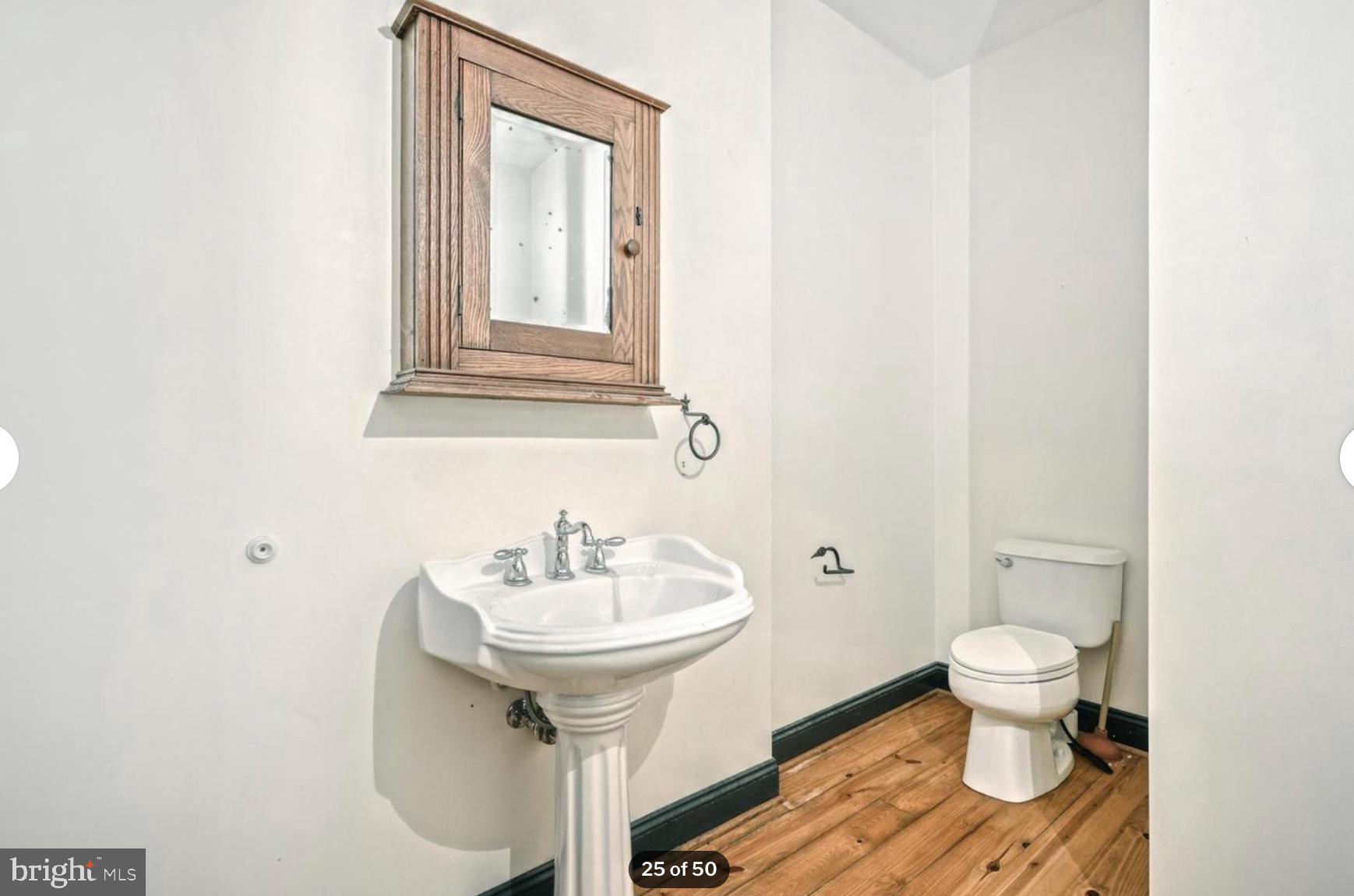 1520 Herrs Ridge Road Gettysburg, PA 17325 - Photo 25 of 51 a bathroom with a sink toilet and a mirror