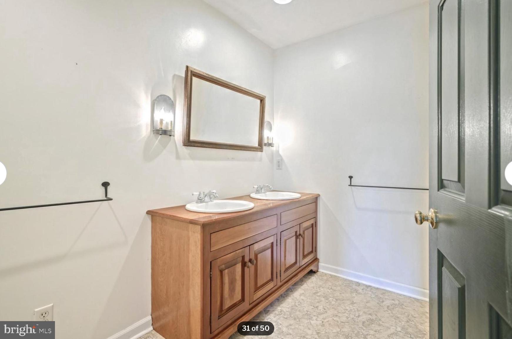 1520 Herrs Ridge Road Gettysburg, PA 17325 - Photo 31 of 51 a bathroom with a sink a mirror and vanity