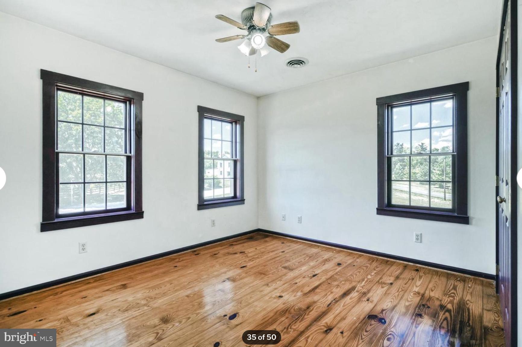 1520 Herrs Ridge Road Gettysburg, PA 17325 - Photo 36 of 51 a view of an empty room with a window and wooden floor