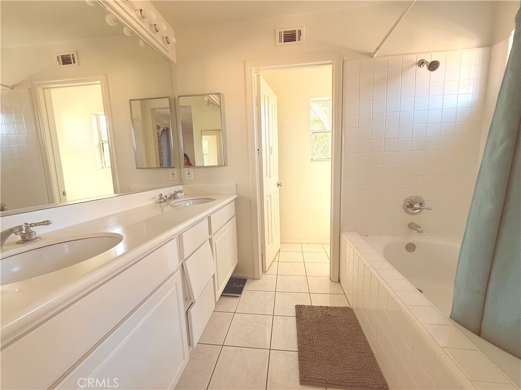 8 Marsala Irvine, CA 92606 - Photo 5 of 8 a spacious bathroom with a tub sink and mirror