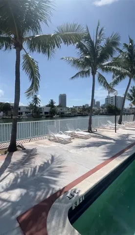 a view of a lake with houses in the back