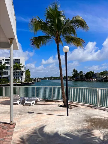 a view of a chair and tables on the terrace