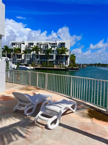 a view of a chairs and table in the patio