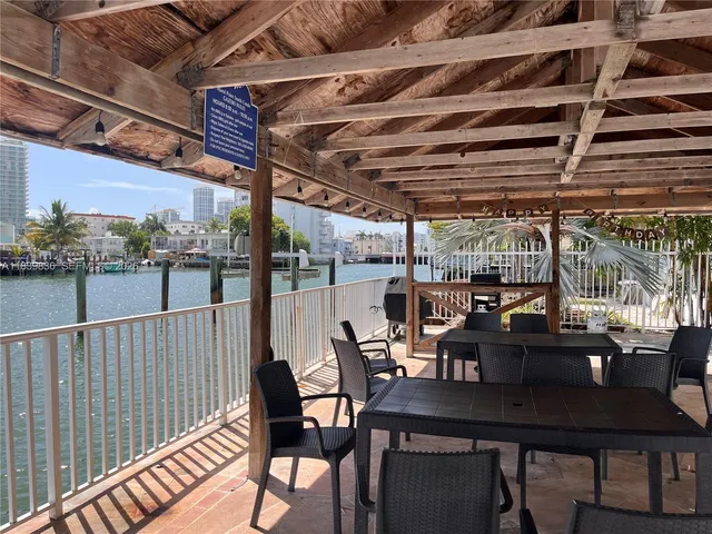 a view of a lake with a table and chairs