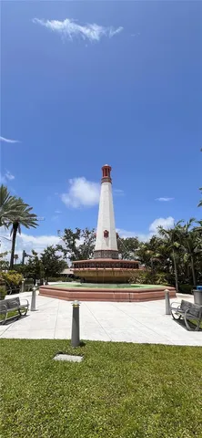 a blue sign sitting on the side of a building
