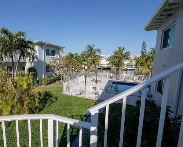 a view of a porch with wooden floor and stairs