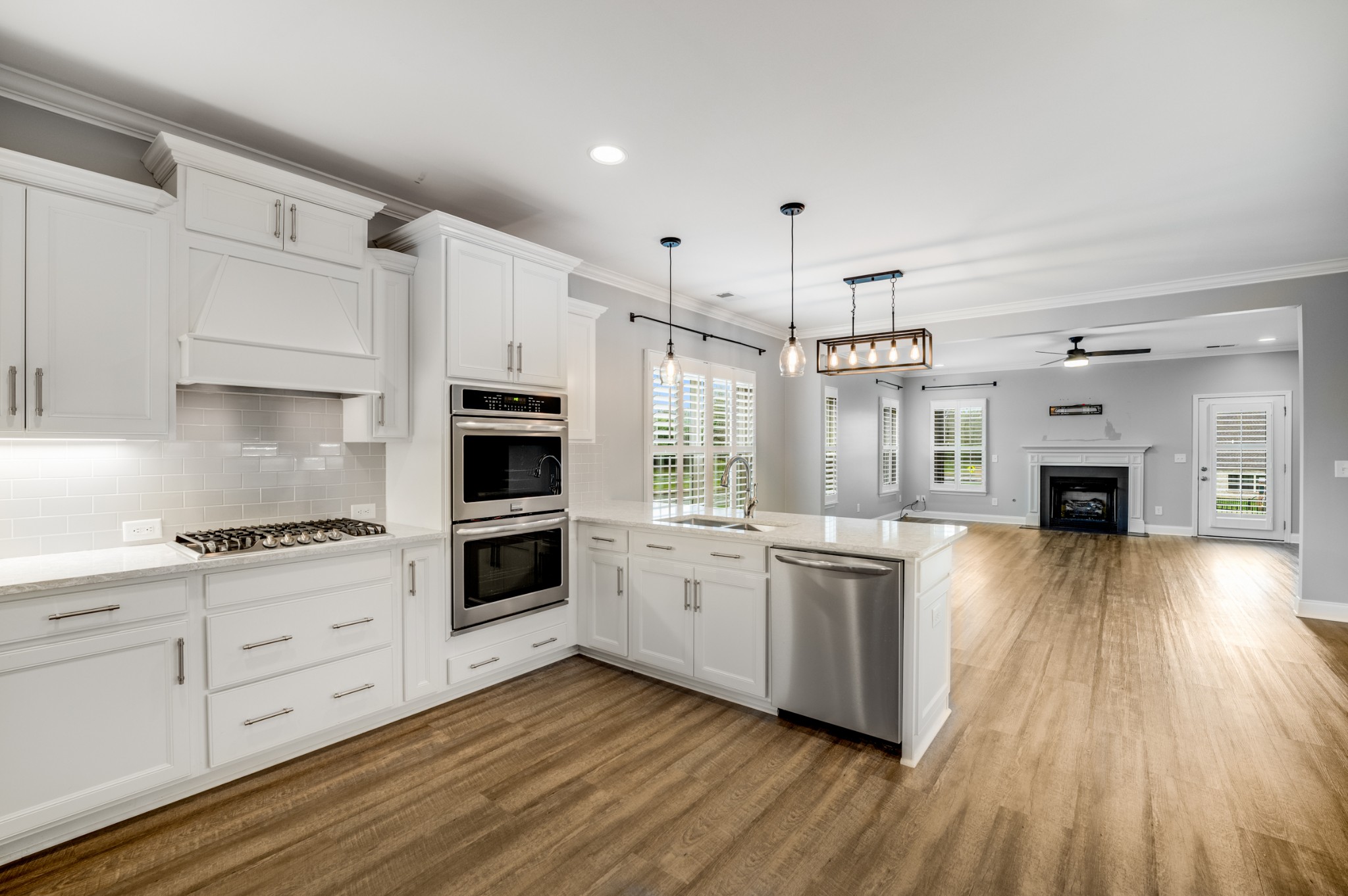 5001 Rizer Point Drive Franklin, TN 37069 - Photo 17 of 42 a kitchen with stainless steel appliances a stove top oven and cabinets