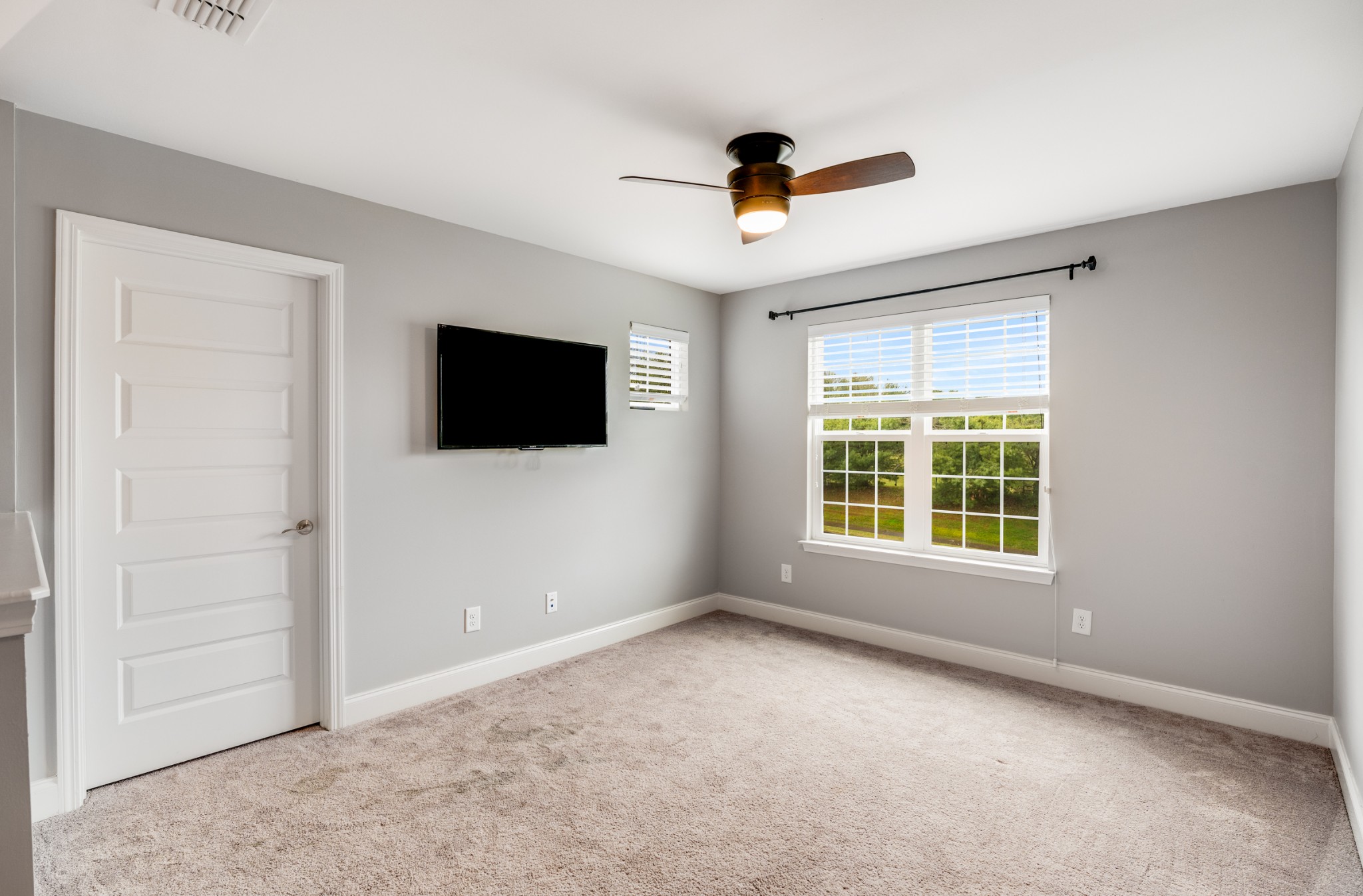 5001 Rizer Point Drive Franklin, TN 37069 - Photo 25 of 42 a view of an empty room with a flat screen tv