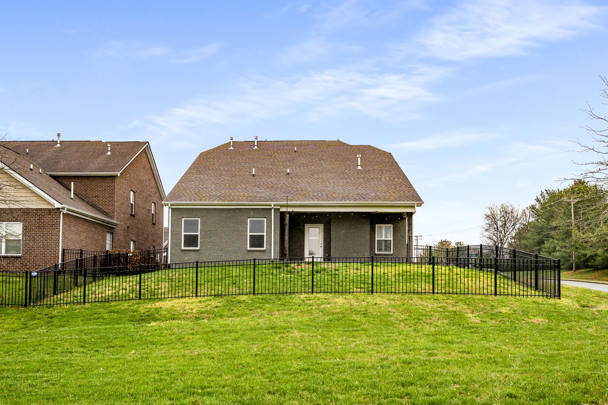 5001 Rizer Point Drive Franklin, TN 37069 - Photo 36 of 42 a brick house with a big yard and more windows