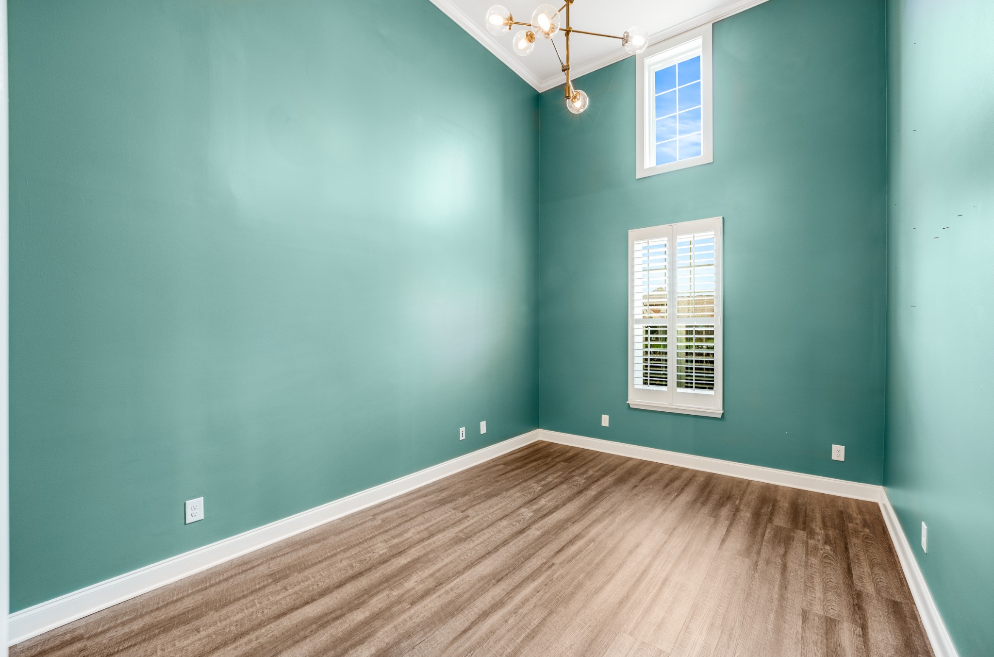 5001 Rizer Point Drive Franklin, TN 37069 - Photo 4 of 42 an empty room with wooden floor and windows