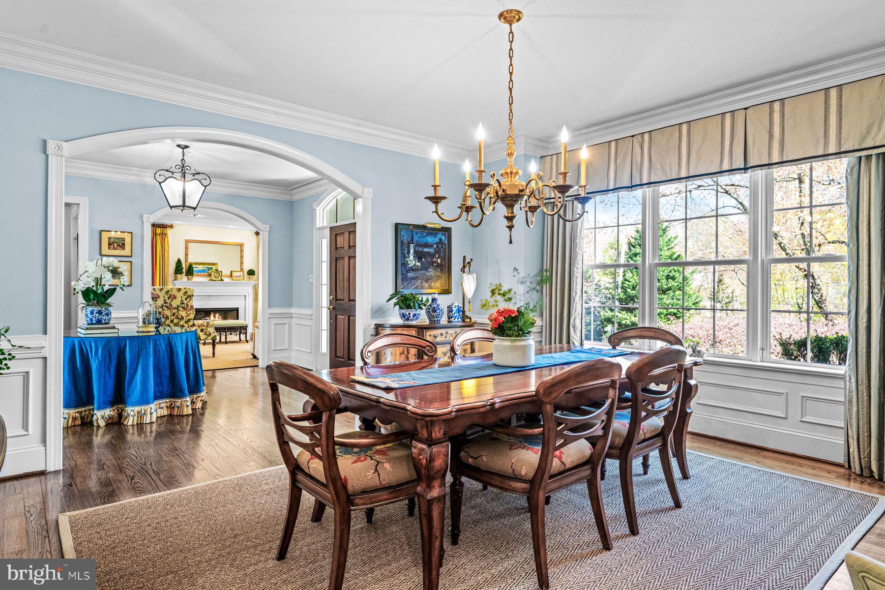 321 Exeter Road Devon, PA 19333 - Photo 21 of 79 a dining room with furniture a chandelier and wooden floor