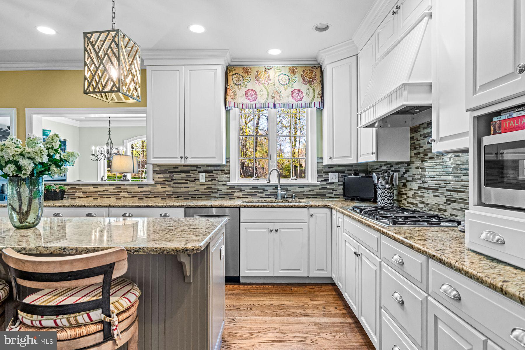 321 Exeter Road Devon, PA 19333 - Photo 24 of 79 a kitchen with a stove a sink and cabinets