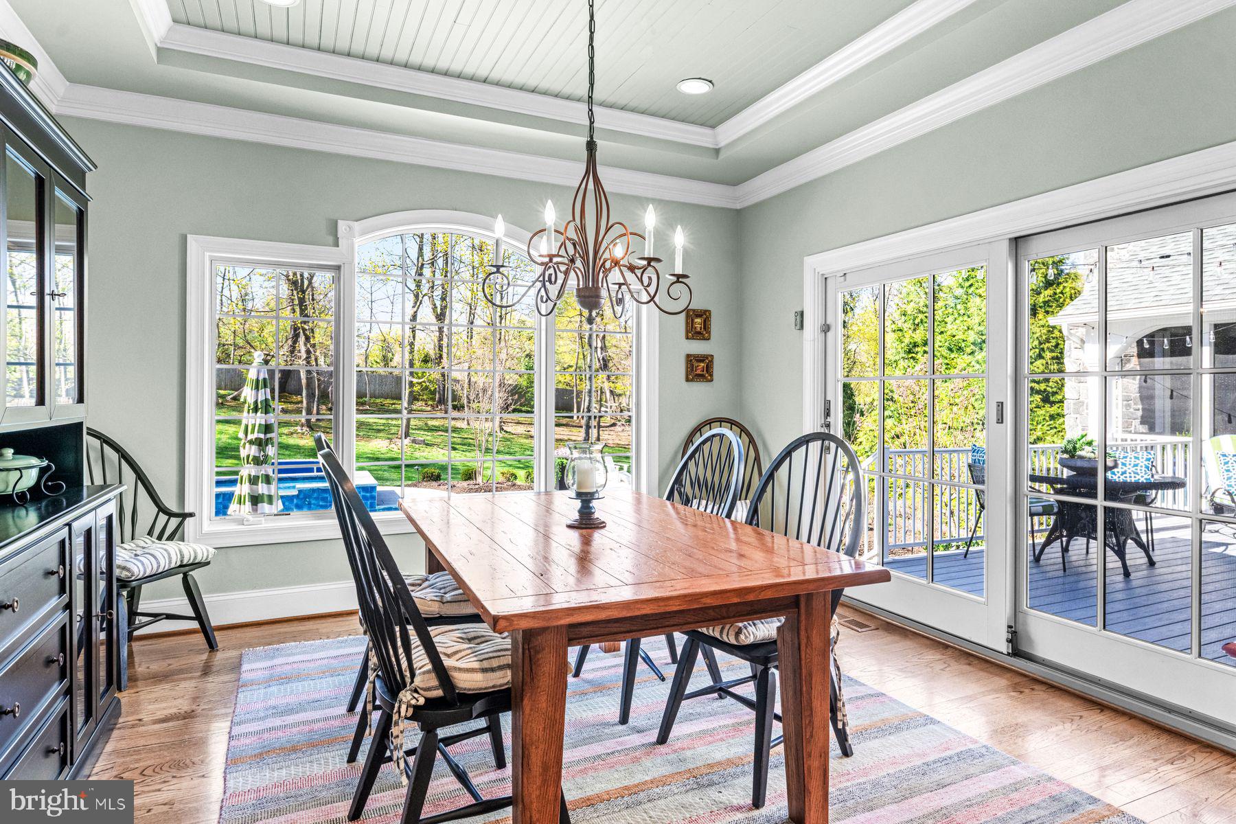 321 Exeter Road Devon, PA 19333 - Photo 28 of 79 a dining room with furniture large windows and wooden floor