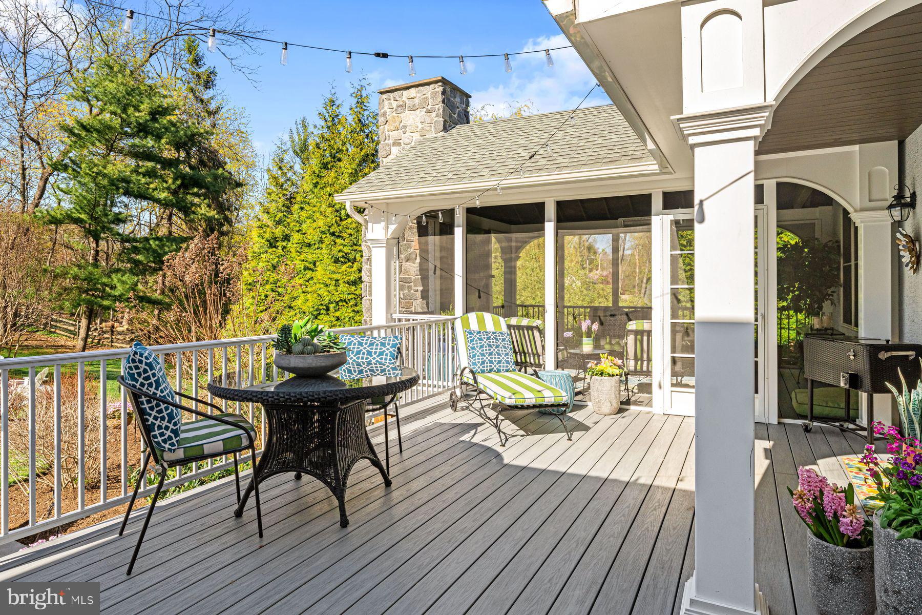 321 Exeter Road Devon, PA 19333 - Photo 30 of 79 a balcony with wooden floor table and chairs