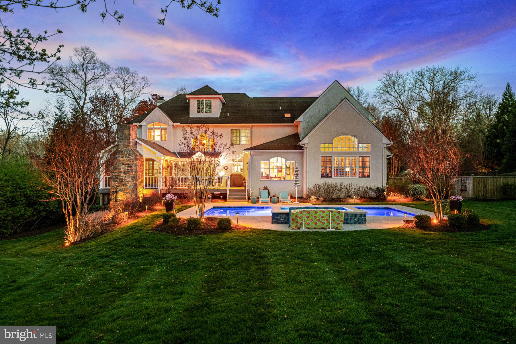 321 Exeter Road Devon, PA 19333 - Photo 3 of 79 a view of a house with a big yard and potted plants
