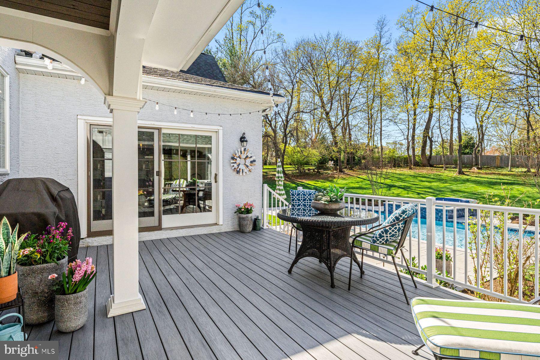 321 Exeter Road Devon, PA 19333 - Photo 33 of 79 a view of a deck with table and chairs and potted plants