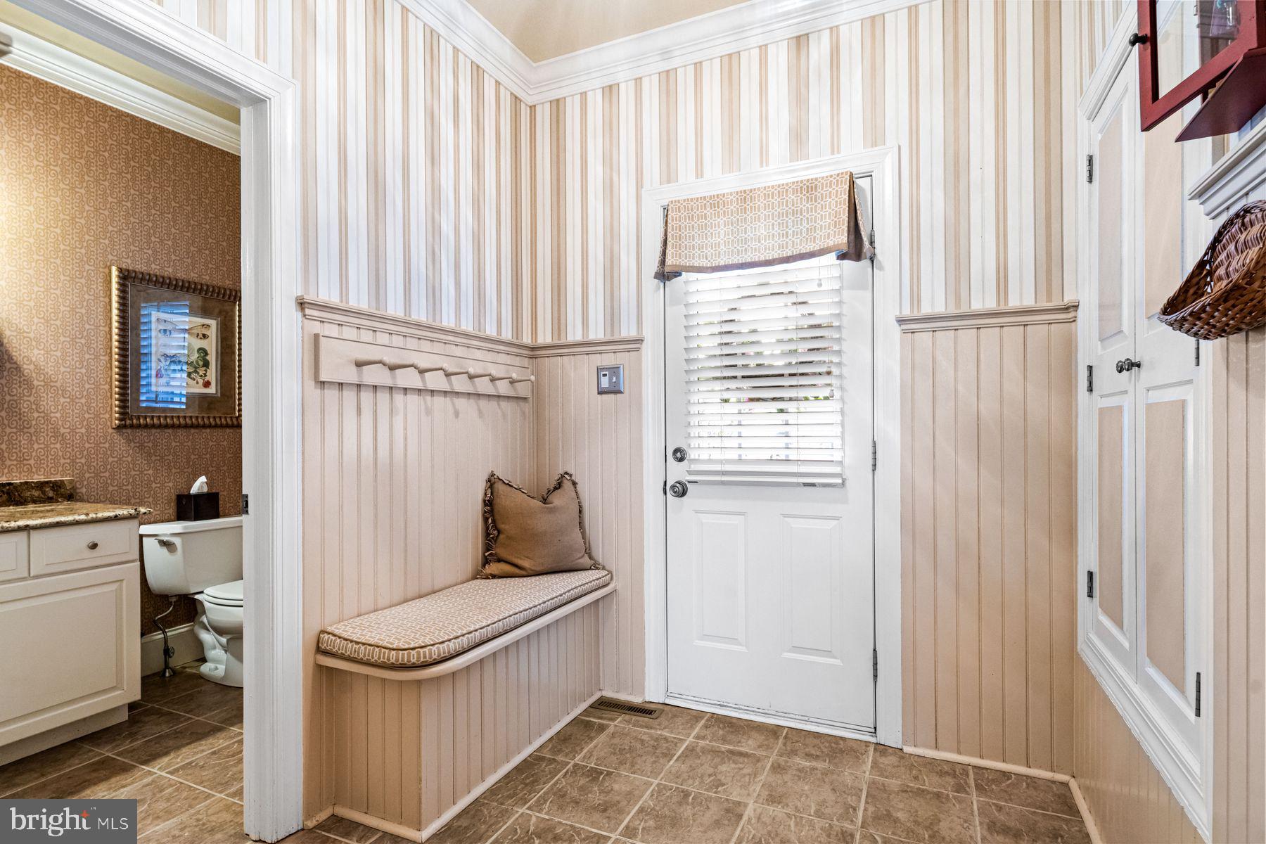 321 Exeter Road Devon, PA 19333 - Photo 37 of 79 a bathroom with a toilet and a shower curtain