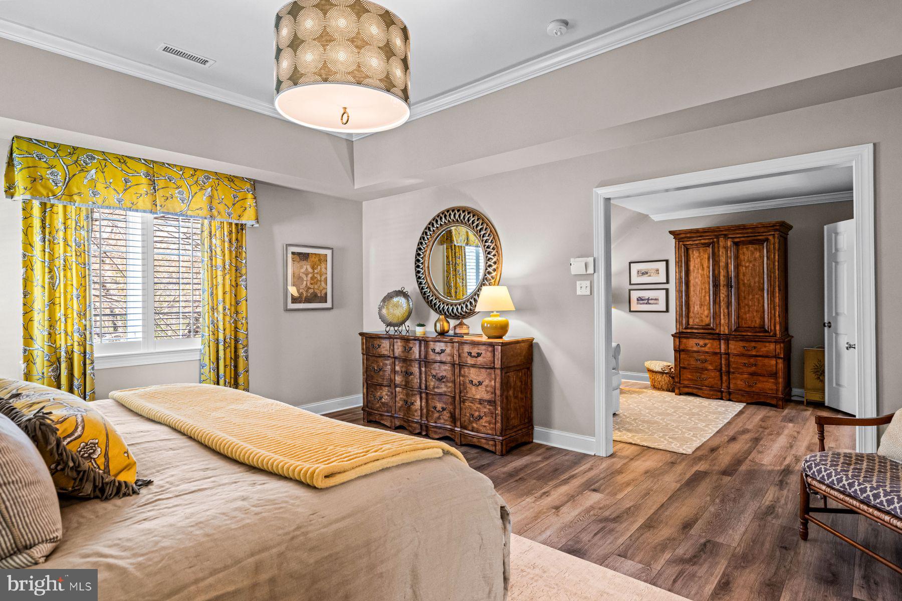 321 Exeter Road Devon, PA 19333 - Photo 47 of 79 a bedroom with a bed a dresser and mirror