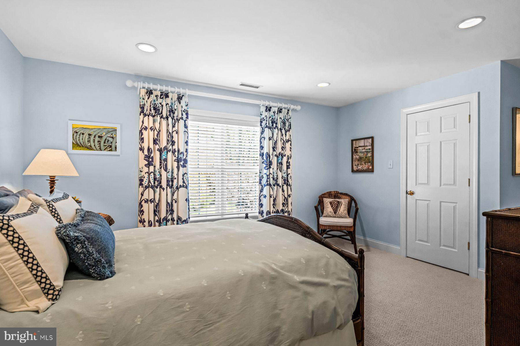 321 Exeter Road Devon, PA 19333 - Photo 53 of 79 a bedroom with a bed and a lamp