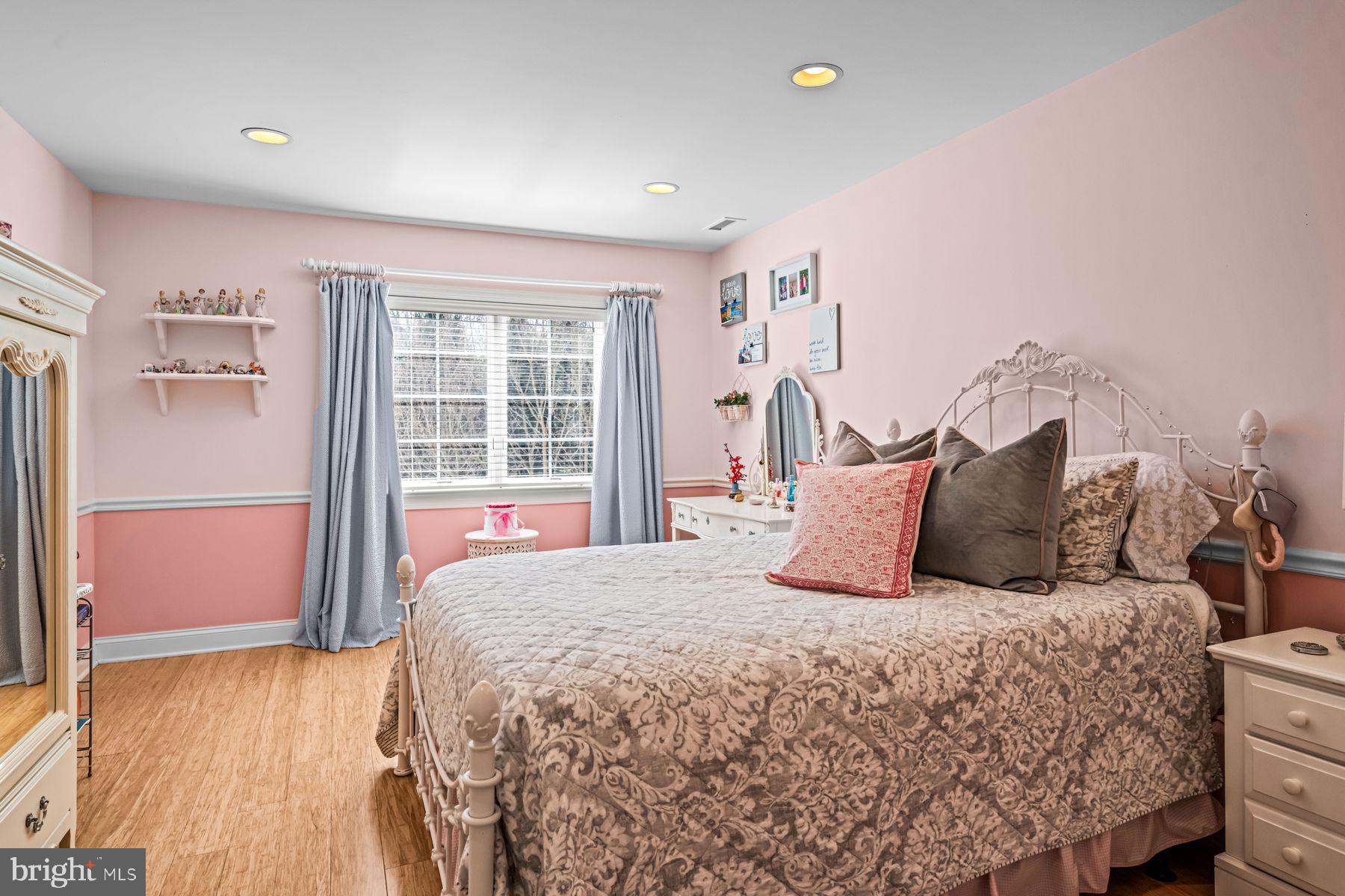 321 Exeter Road Devon, PA 19333 - Photo 58 of 79 a large bed sitting in a bedroom next to a window