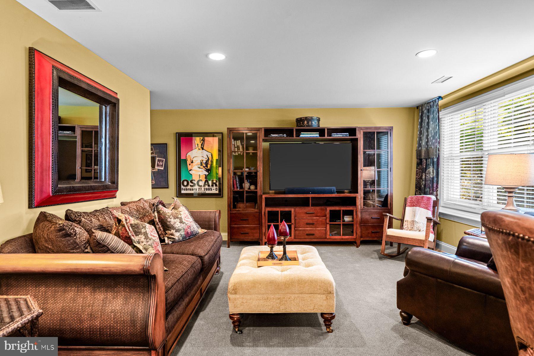 321 Exeter Road Devon, PA 19333 - Photo 65 of 79 a living room with furniture and a flat screen tv